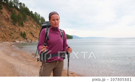 Hiking tourism adventure. Backpacker hiker woman looking at